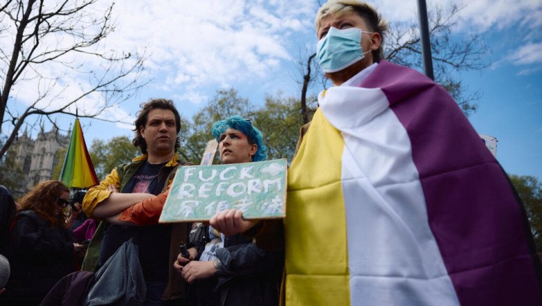 Thousands rally for trans rights after top UK court backs ‘biological’ definition of woman