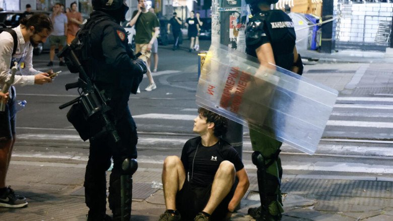 Serbia's police intervene as ruling party supporters face off against anti-government protesters